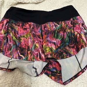 Size 4 lululemon speed ups 4”. They are a swirly multicoloured pattern.